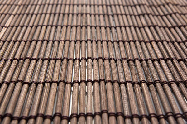 Brown bamboo mat stand food, close up, macro