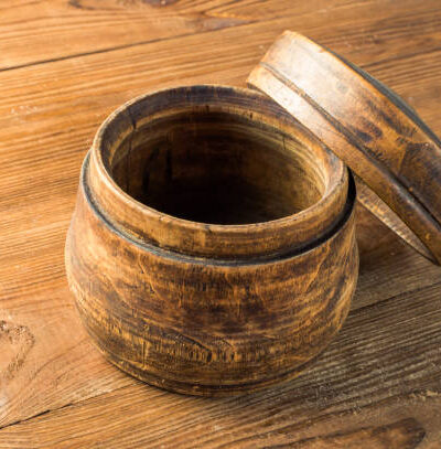 Blank wooden bowl on the table background.