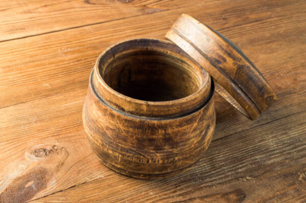 Blank wooden bowl on the table background.