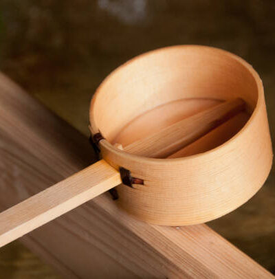 Wooden dipper of holy zen water in japan shinto temple