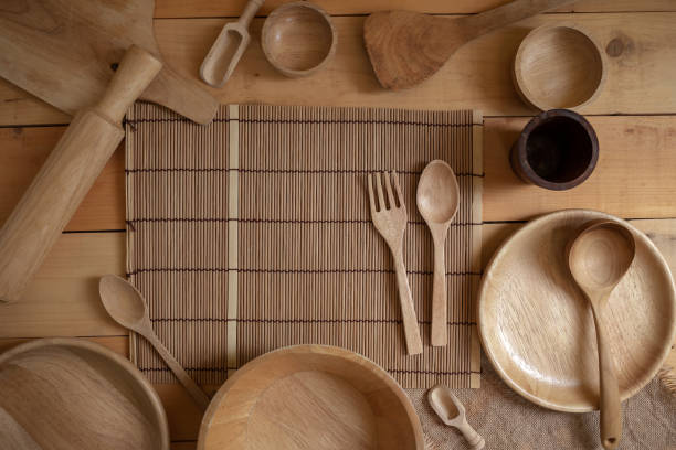 Wooden kitchenware on natural pattern wood background. top view.