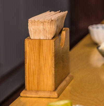 Tissue paper in the elegant yellow bamboo holder in the restaurant